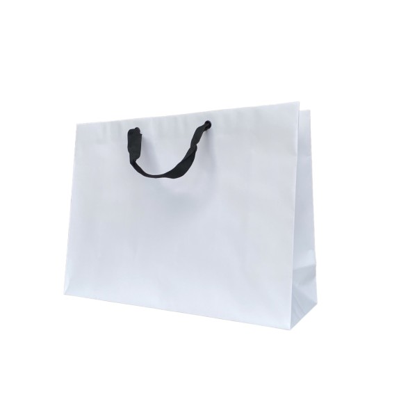 White paper bag with black ribbon handles