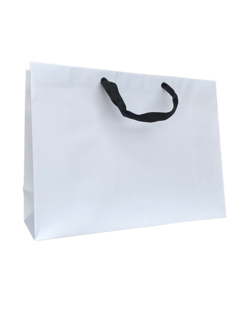 White paper bag with black ribbon handles